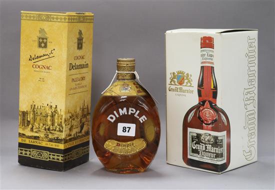 Three bottles: Delmaine Cognac (boxed), Dimple Haig blended whisky and Grand Marnier